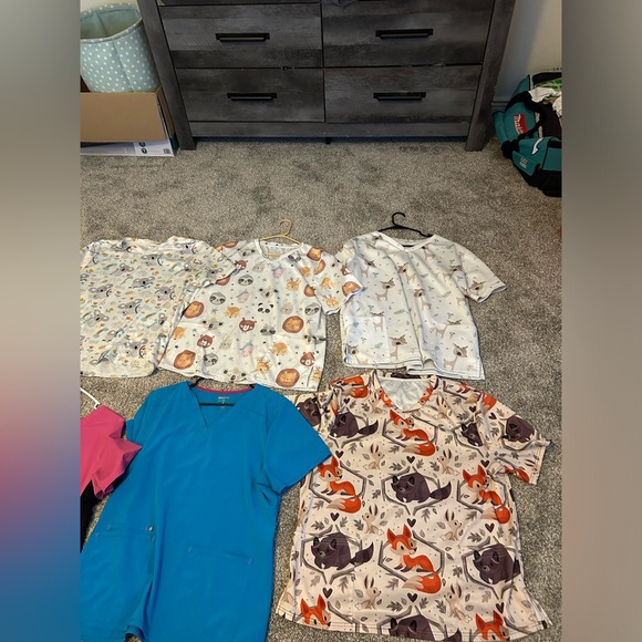 I have 6 scrub tops, one pair of scrub pants and 2 sets of scrubs. - Picture 1 of 3